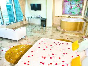 a room with a bed with hearts on the floor at Imperia City in Moscow
