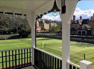 a tennis court with a tennis court at Central City Castle Apartment with FREE parking in Nottingham