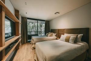 Ένα ή περισσότερα κρεβάτια σε δωμάτιο στο Get Hotel Molvento, AKEN Soul Collection