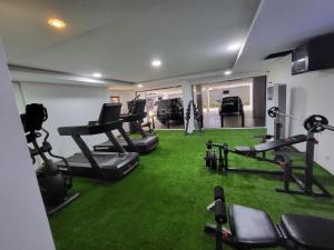 a fitness room with treadmills and treadmill machines at Ikoyi/Banana Studio Room in Lagos