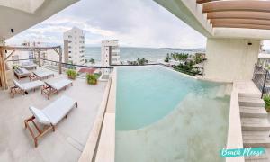 a swimming pool on the roof of a building at Arenka - 2BR w Private Pool & Sunset Rooftop in Bucerías