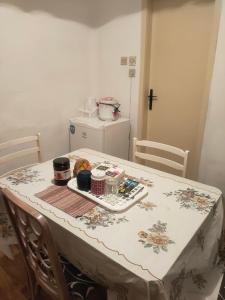 a table with a table cloth on top of it at Warm and comfortable apartment in Subotica