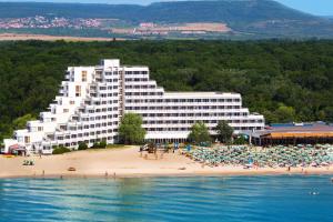 a large hotel on a beach with people on the beach at Hotel Gergana - Ultra All Inclusive in Albena