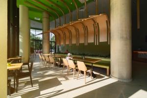 a group of tables and chairs in a restaurant at Hotel Gergana - Ultra All Inclusive in Albena