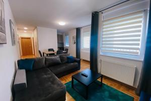 Predel za sedenje v nastanitvi Apartmani Milan