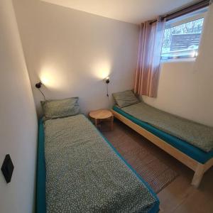 En eller flere senger på et rom på Ramfjord Apartment