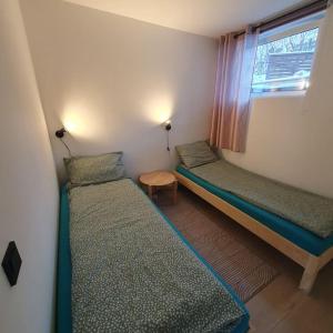 Ένα ή περισσότερα κρεβάτια σε δωμάτιο στο Ramfjord Apartment +3 φωτογραφίες