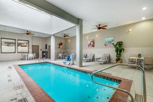 a swimming pool in a hotel room with a pool at Best Western Premier Historic Travelers Hotel Alamo/Riverwalk in San Antonio