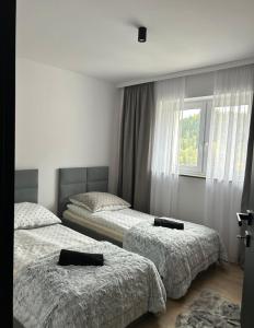Leśne Wzgórze Apartamenty客房内的一张或多张床位
