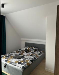 Leśne Wzgórze Apartamenty客房内的一张或多张床位