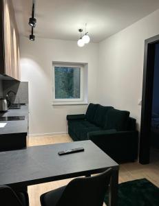 Leśne Wzgórze Apartamenty的休息区