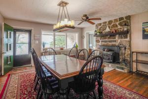 a dining room with a wooden table and chairs at Sunset View in Hazelhurst