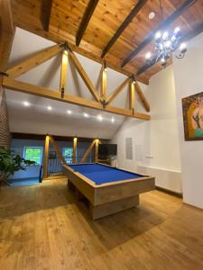 a large room with a pool table in it at Na Uboczu in Gryfów Śląski