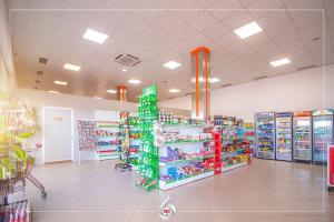 a store aisle with shelves of toys and other items at NBT Hotel Lac in Laç