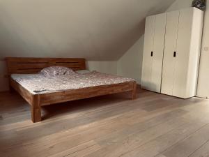 En eller flere senge i et værelse på Vesta Waldhaus Bardowicker Heide