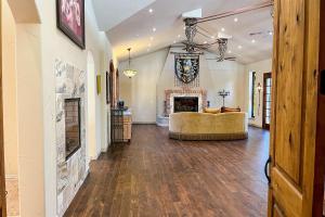 a living room with a fireplace and a couch at Mediterranean Mountain Memories in Colorado Springs