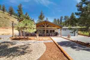 a large house with a garage in front of it at Welcome! 4 bedroom (6 bed) 3 bath River House in Sedalia