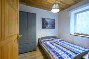 Ένα ή περισσότερα κρεβάτια σε δωμάτιο στο Chata Dolinka +34 φωτογραφίες