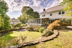 a large white house with a large yard at Historic Mamaroneck Guest House - Walk to Harbor! 