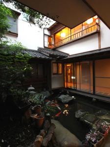 a koi pond in the courtyard of a house at Sinonomesou in Toyooka