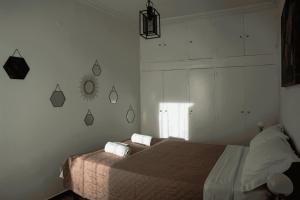 מיטה או מיטות בחדר ב-Sigma Acropolis Upstairs