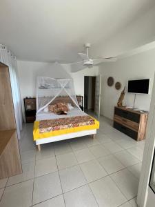 Ένα ή περισσότερα κρεβάτια σε δωμάτιο στο Villa Ti Lanmou