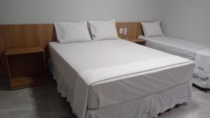Postel nebo postele na pokoji v ubytování Hotel Bonina