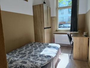 Łóżko lub łóżka w pokoju w obiekcie Pokoje na wynajem Gdańsk
