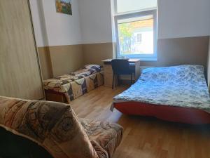 Łóżko lub łóżka w pokoju w obiekcie Pokoje na wynajem Gdańsk
