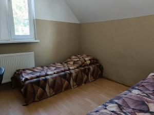 Łóżko lub łóżka w pokoju w obiekcie Pokoje na wynajem Gdańsk