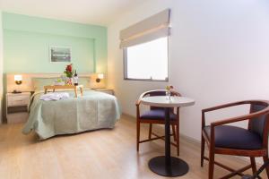 Postel nebo postele na pokoji v ubytování Hotel San Blas