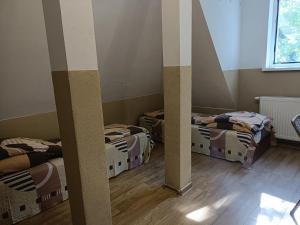 Łóżko lub łóżka w pokoju w obiekcie Pokoje na wynajem Gdańsk