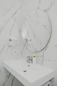 a bathroom with a white sink and a mirror at Sunway Rome in Rome +31 photos