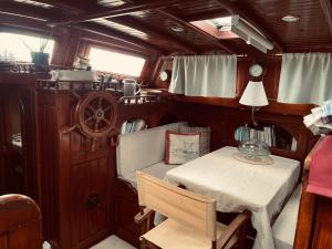 a small table and chair in the back of a boat at Dreaming of Ithaca in Las Palmas de Gran Canaria