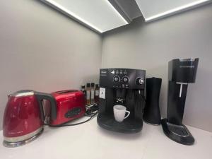 a kitchen counter with a coffee maker and a toaster at Exclusive, cosy, elegant Frogner apartment in the center of Oslo in Oslo