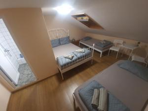 Postel nebo postele na pokoji v ubytování HANCHO - KAPANA CENTER PLOVDIV