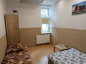 Łóżko lub łóżka w pokoju w obiekcie Pokoje na wynajem Gdańsk