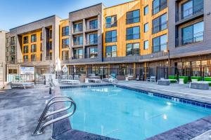 a swimming pool in front of a building at Canyons Resort Village #304 in Park City