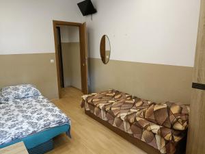 Łóżko lub łóżka w pokoju w obiekcie Pokoje na wynajem Gdańsk