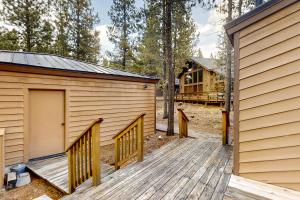 a wooden ramp leading to a building with a garage at Jackalope Manor in Sunriver