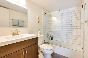 a bathroom with a toilet and a sink and a shower at Mtn-View Condo with Community Perks in Silverthorne in Silverthorne