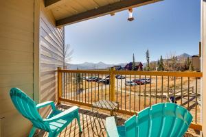 two chairs on a porch with a view of a parking lot at Mtn-View Condo with Community Perks in Silverthorne in Silverthorne