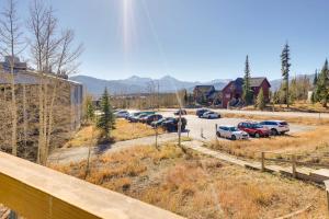 a parking lot with a bunch of cars parked at Mtn-View Condo with Community Perks in Silverthorne in Silverthorne