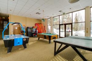 a play room with two ping pong tables in it at Mtn-View Condo with Community Perks in Silverthorne in Silverthorne