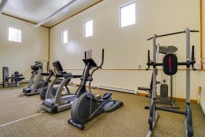 a row of exercise bikes in a gym at Mtn-View Condo with Community Perks in Silverthorne in Silverthorne