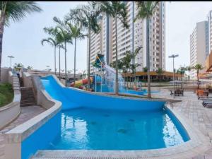 a pool at a resort with a water slide at Enjoy Solar das Águas Olímpia in Olímpia