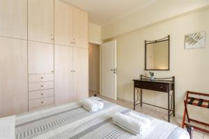 Postel nebo postele na pokoji v ubytování Amarlia Villa