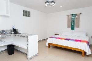 Postel nebo postele na pokoji v ubytování Linda Vecindad Playa del Carmen