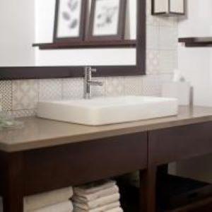 a bathroom counter with a sink and a mirror at Independence Stay Hotel & Suites in Marinette