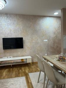 A television and/or entertainment centre at PANDORA AVENY CACAK